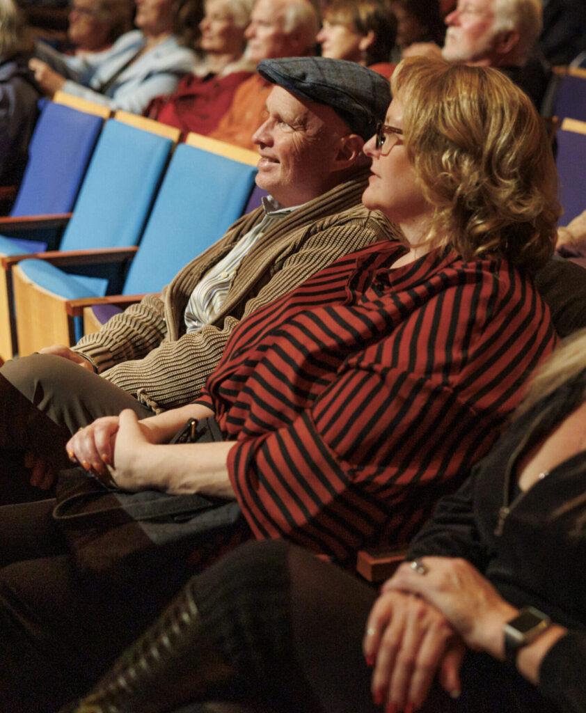 Attendees sit in Helzberg Hall.